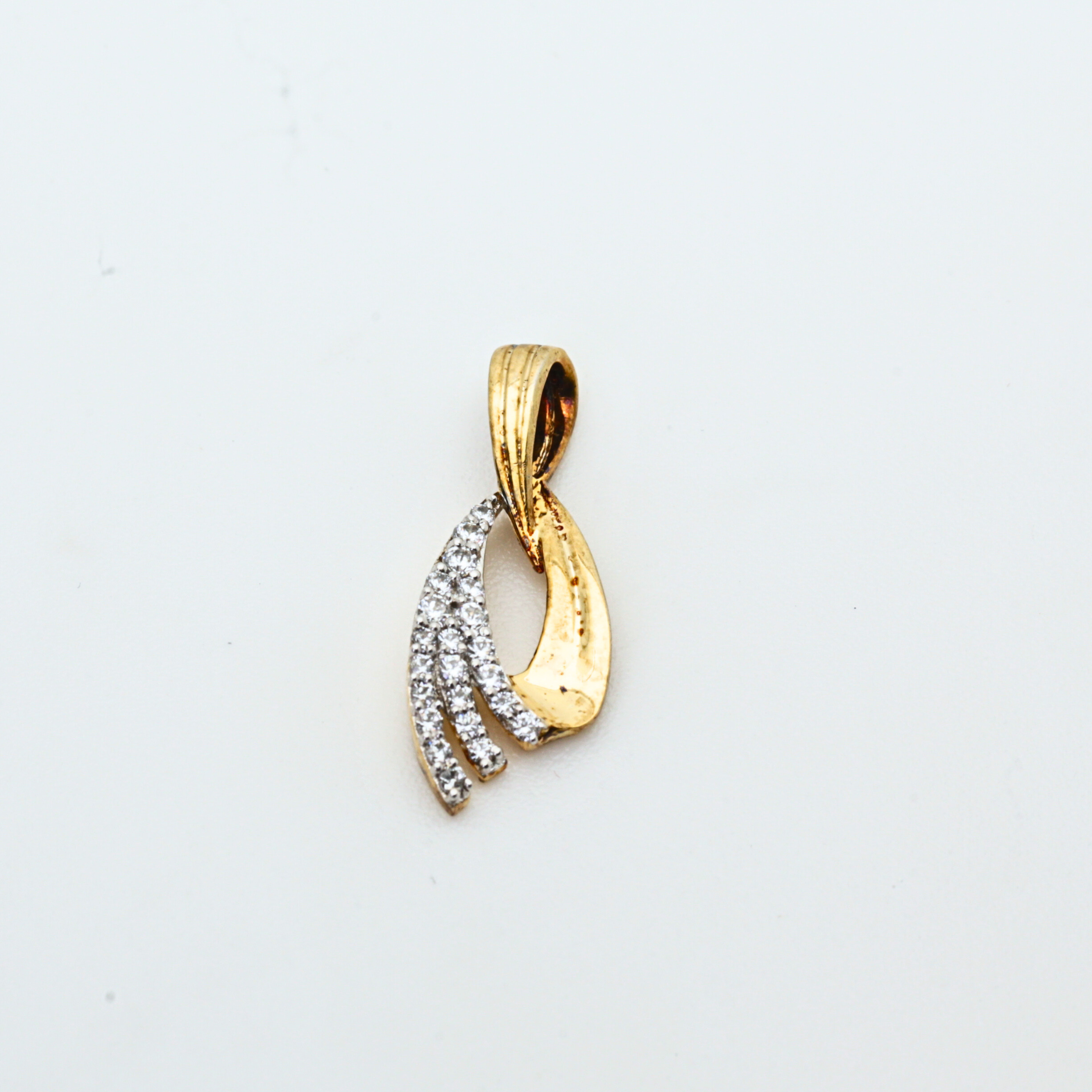Gold Pendant With Flowing Curve Design And Stone Detailing