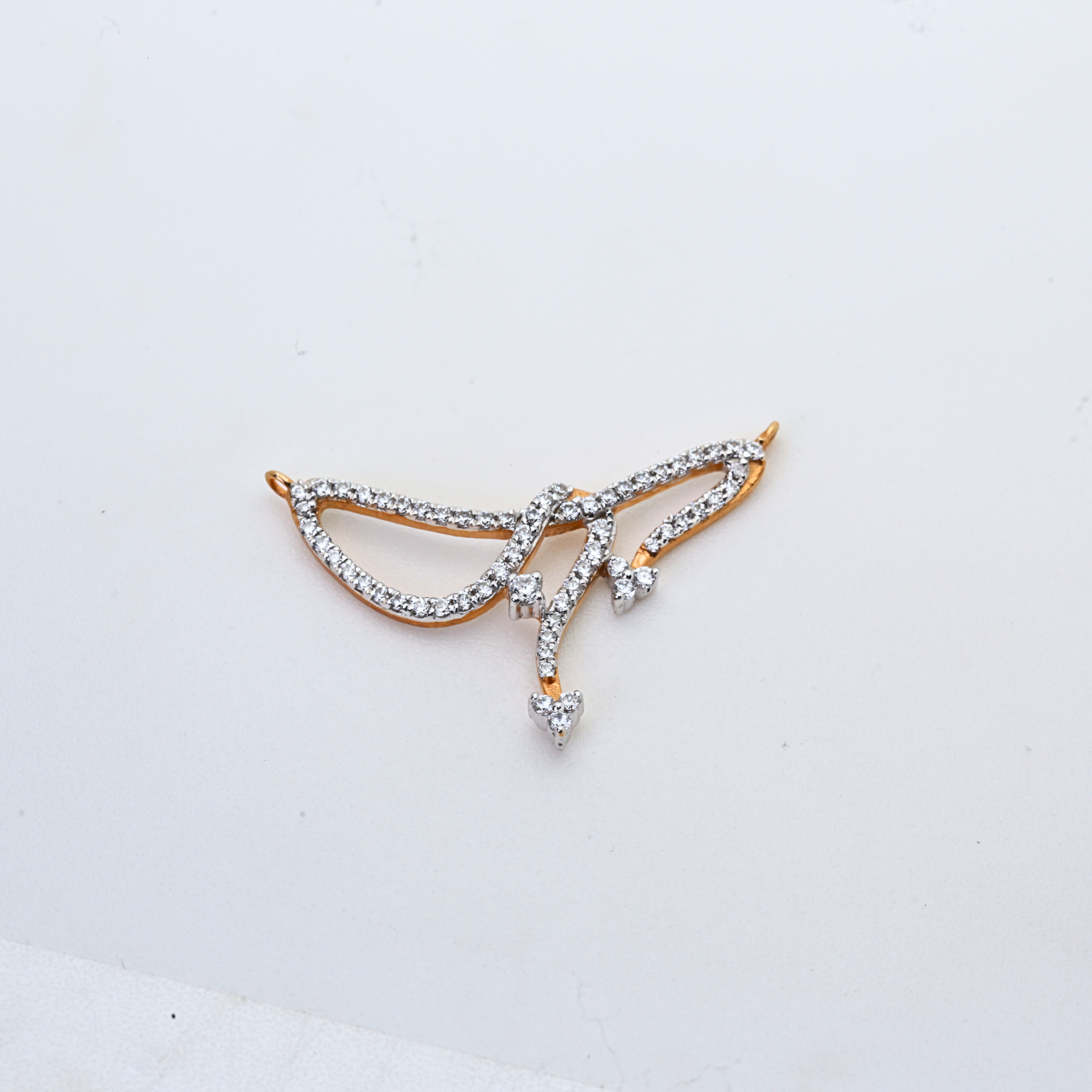Abstract Wing Shape Gold Pendant With Stone Work
