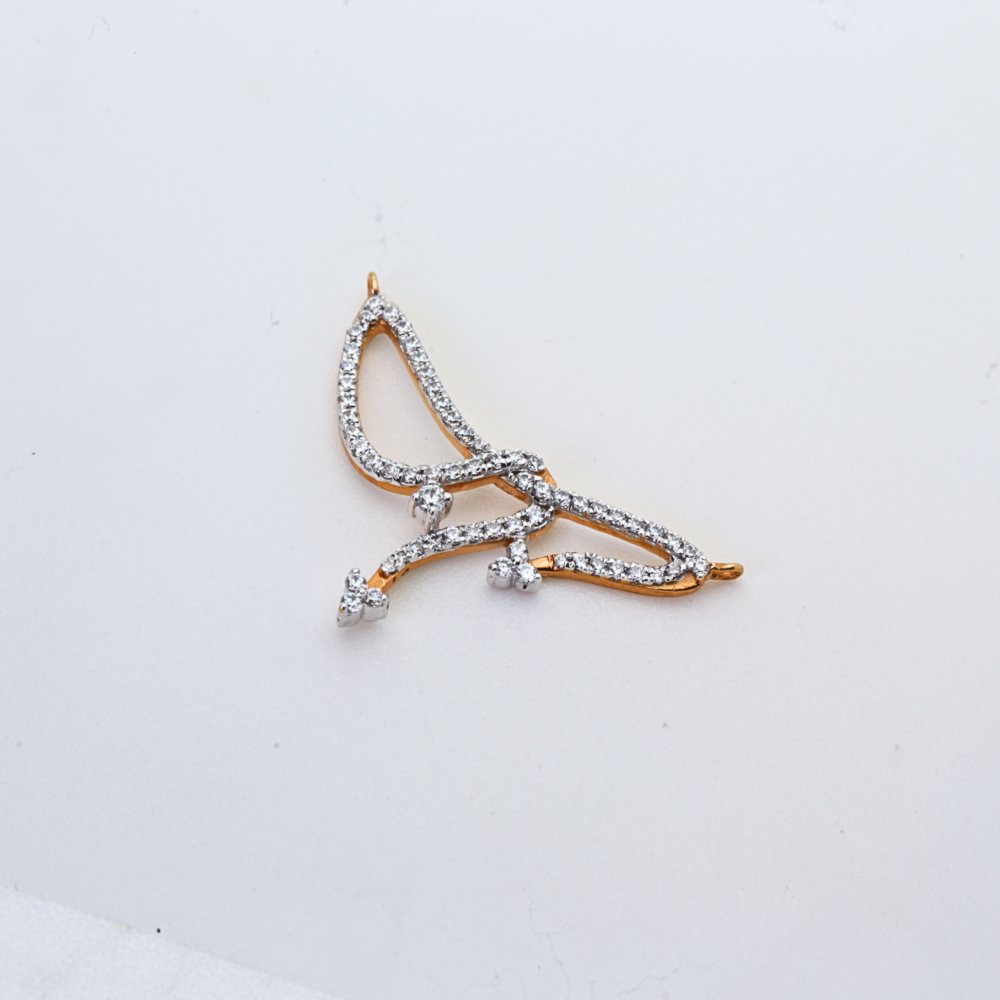 Abstract Wing Shape Gold Pendant With Stone Work