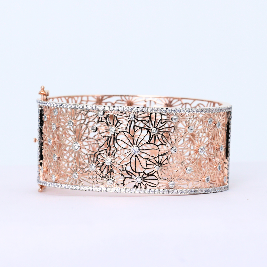 Lace cuff bangle detail
Modern diamond bangle design
Center floral diamond
Halo and band close up
Gold floral cuff bangle
Floral inspired diamond design
Brilliant cut diamond cuff
Diamond bangle in natural light
Floral lace halo diamond bangle
Minimalist floral cuff