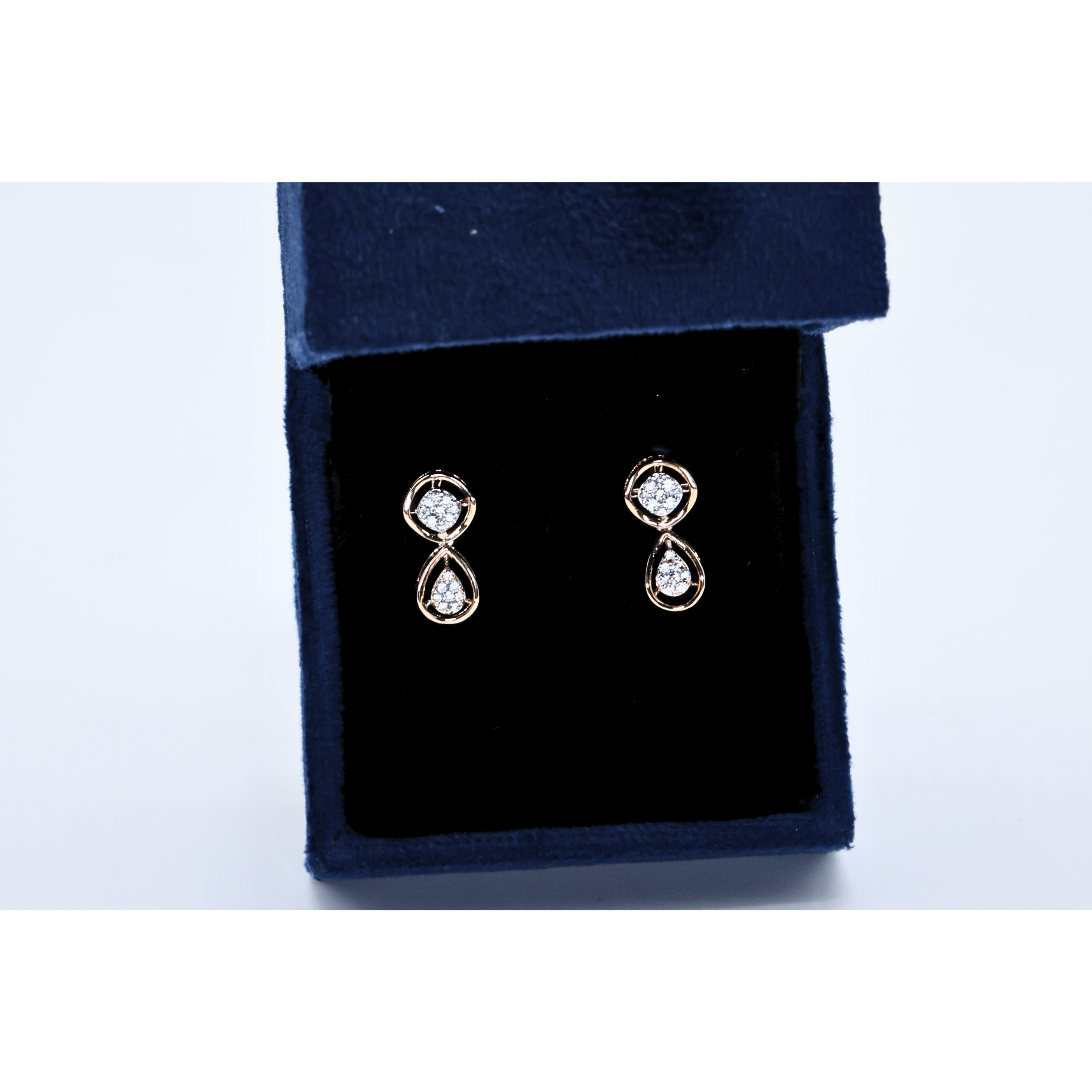 Diamond earrings two halo pattern
Dual halo earrings minimal design
Drop earrings with circular halos
Dual halo earrings full view
Drop earrings laying flat
Diamond earrings with polished metal
Dual halo earrings centered shot
Drop earrings rounded shape
Diamond earrings hanging from hooks
Drop earrings with small diamonds