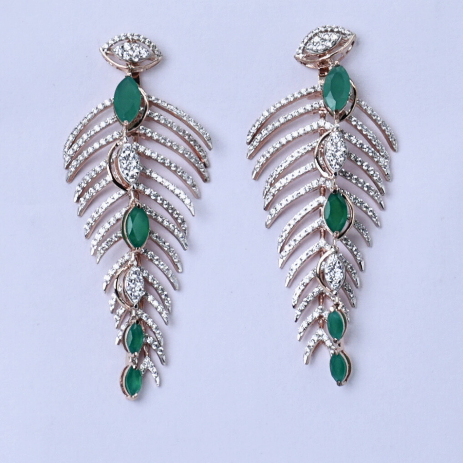 Green Luxe cascade earrings
Emerald green luxury earrings
Green cascade earrings
Elegant green earrings
Green gemstone cascade earrings
Front view green cascade earrings
Delicate green gemstone earrings
Pair of green Luxe earrings
Green earrings on display
Shimmering green cascade earrings