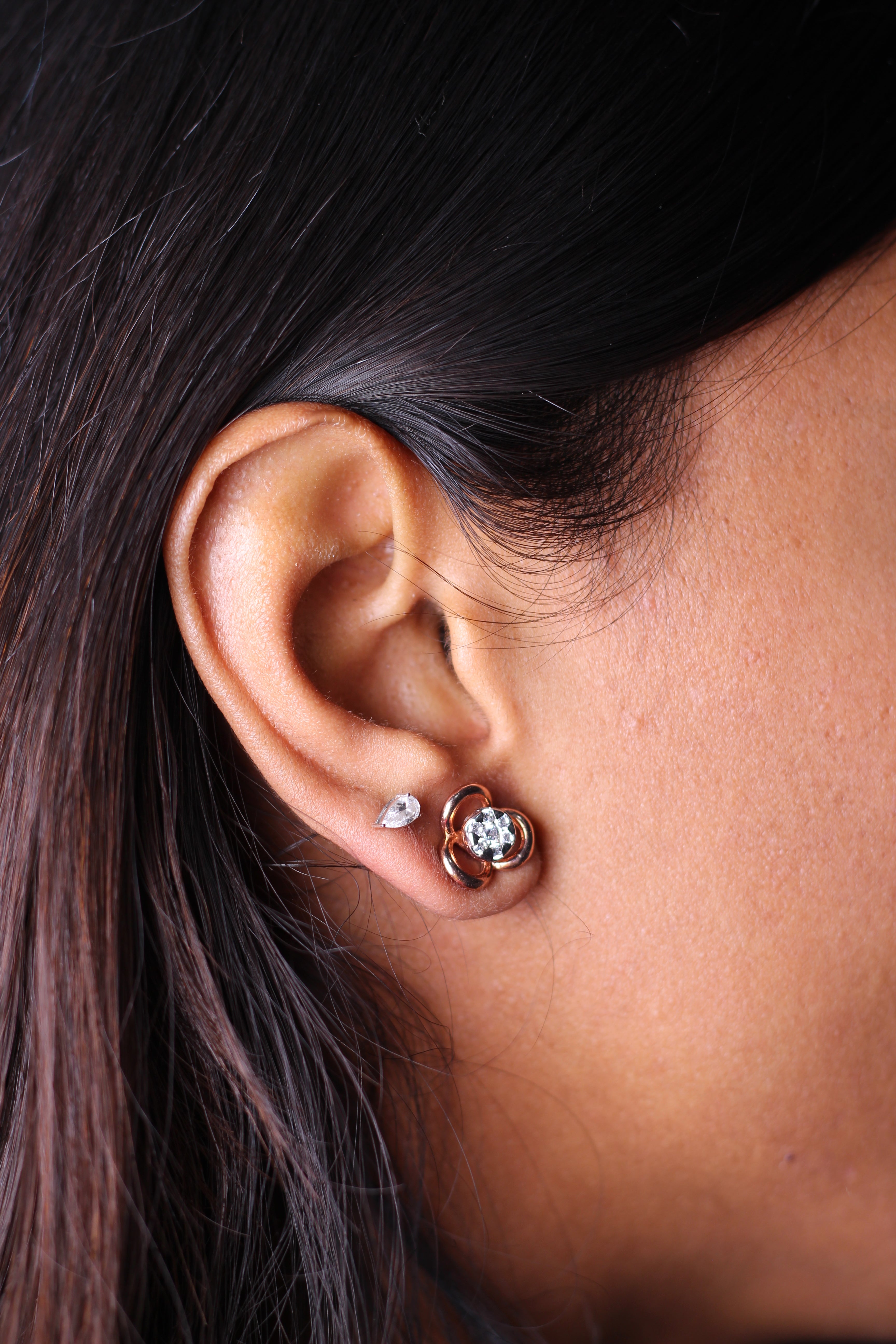 Three Petal Flower Shape Gold Stud Earrings With Round Stone