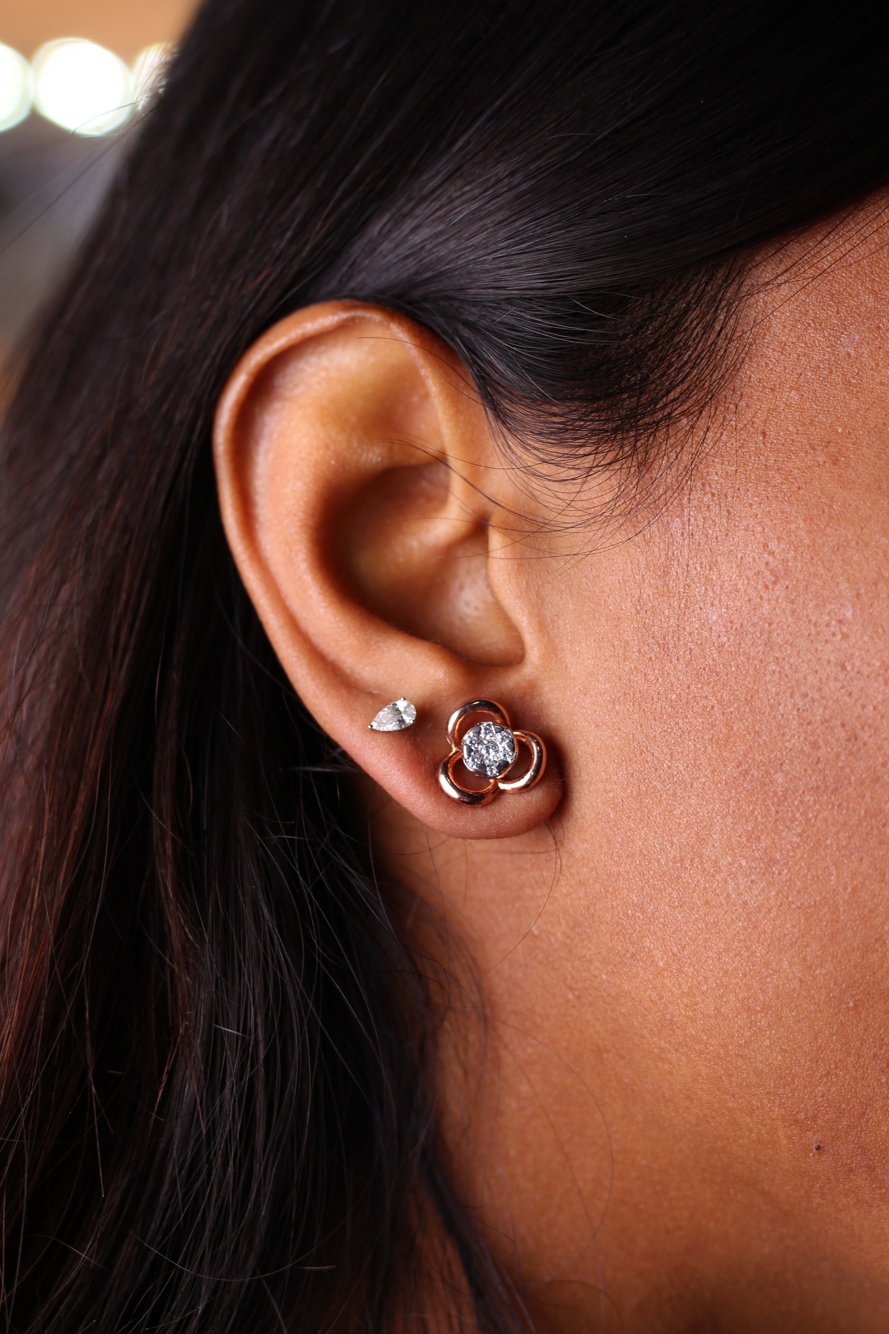 Three Petal Flower Shape Gold Stud Earrings With Round Stone