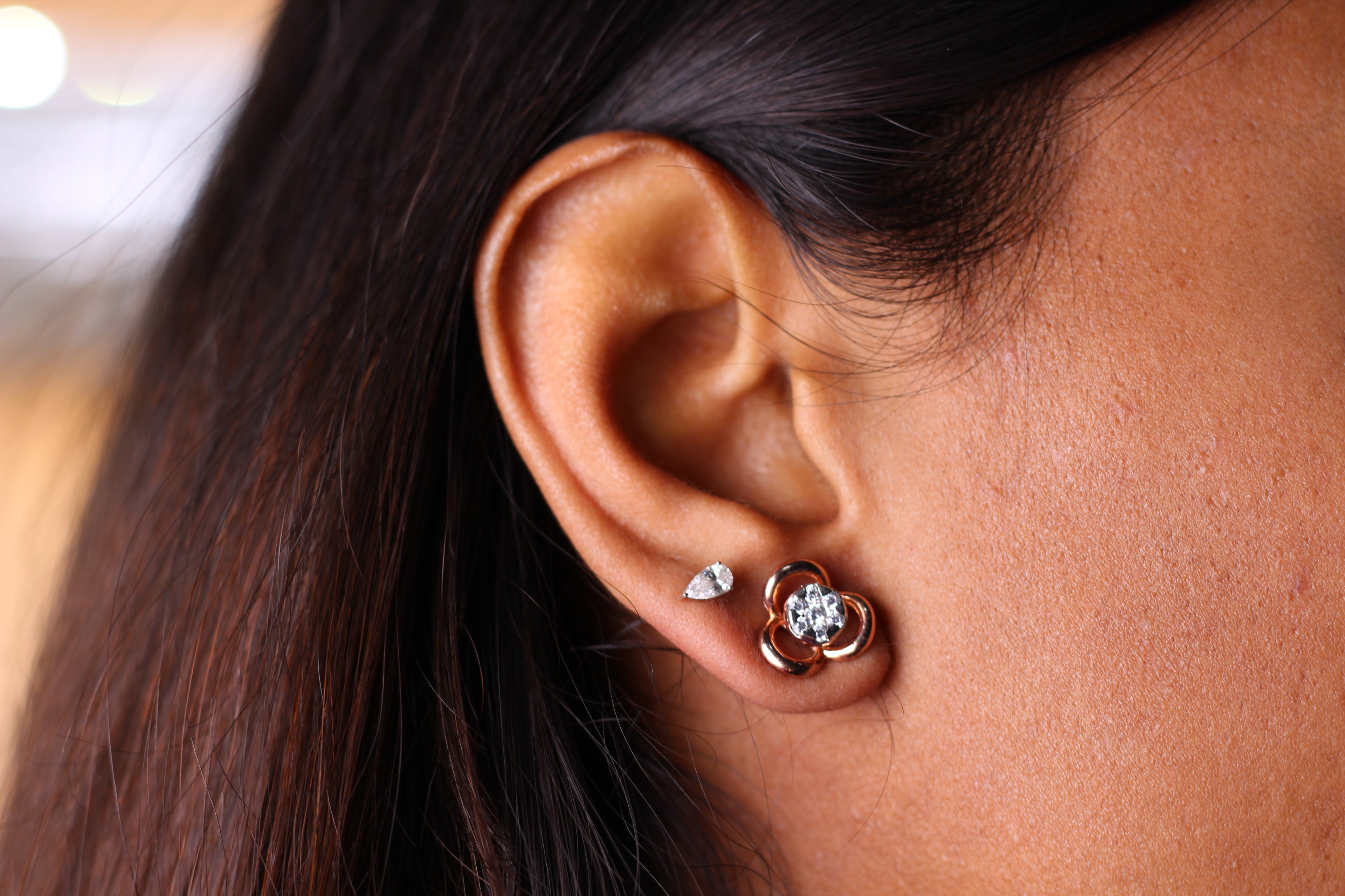 Three Petal Flower Shape Gold Stud Earrings With Round Stone