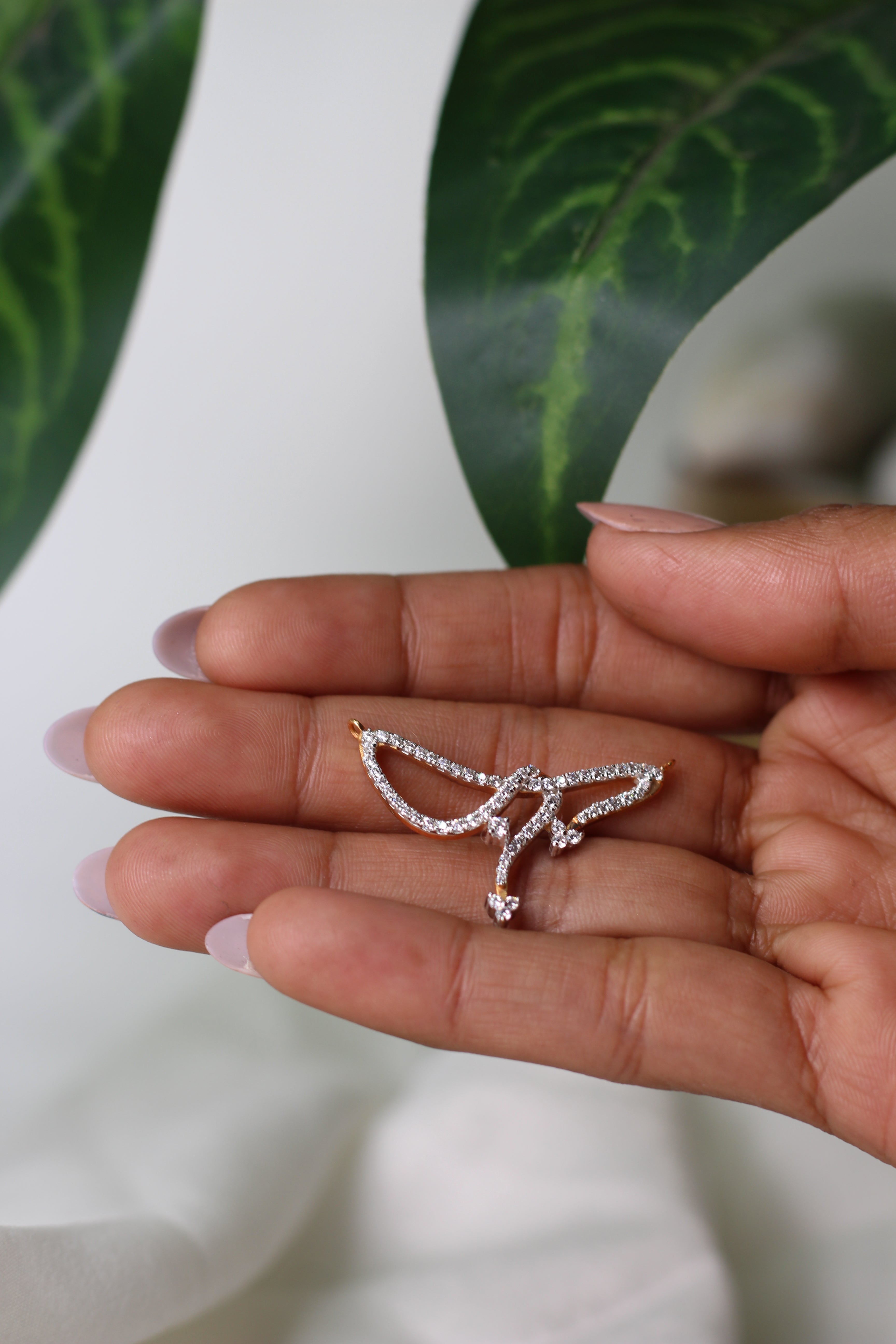 Abstract Wing Shape Gold Pendant With Stone Work