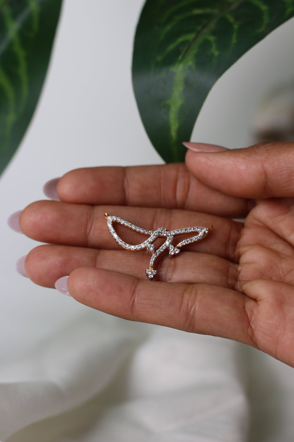 Abstract Wing Shape Gold Pendant With Stone Work