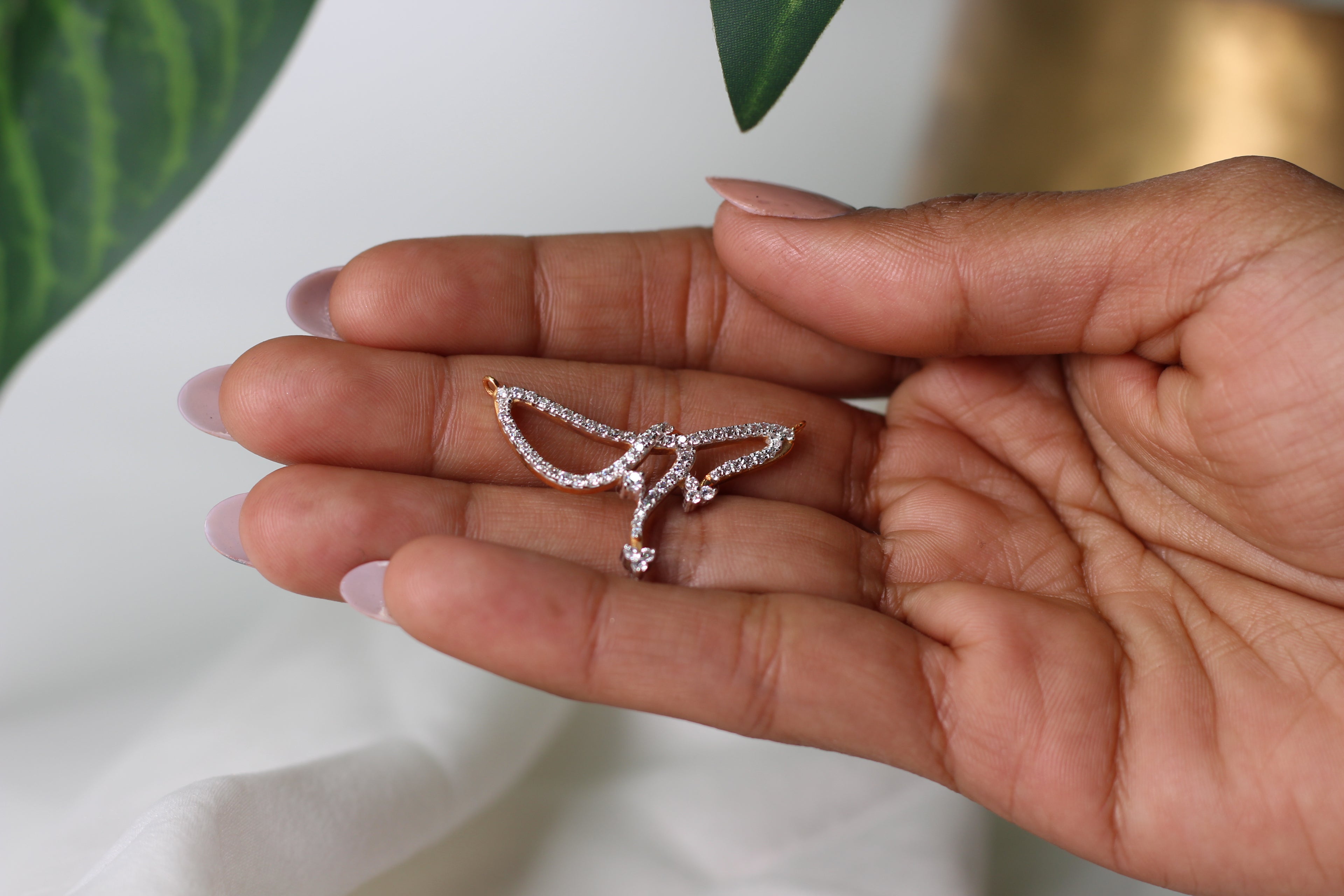 Abstract Wing Shape Gold Pendant With Stone Work