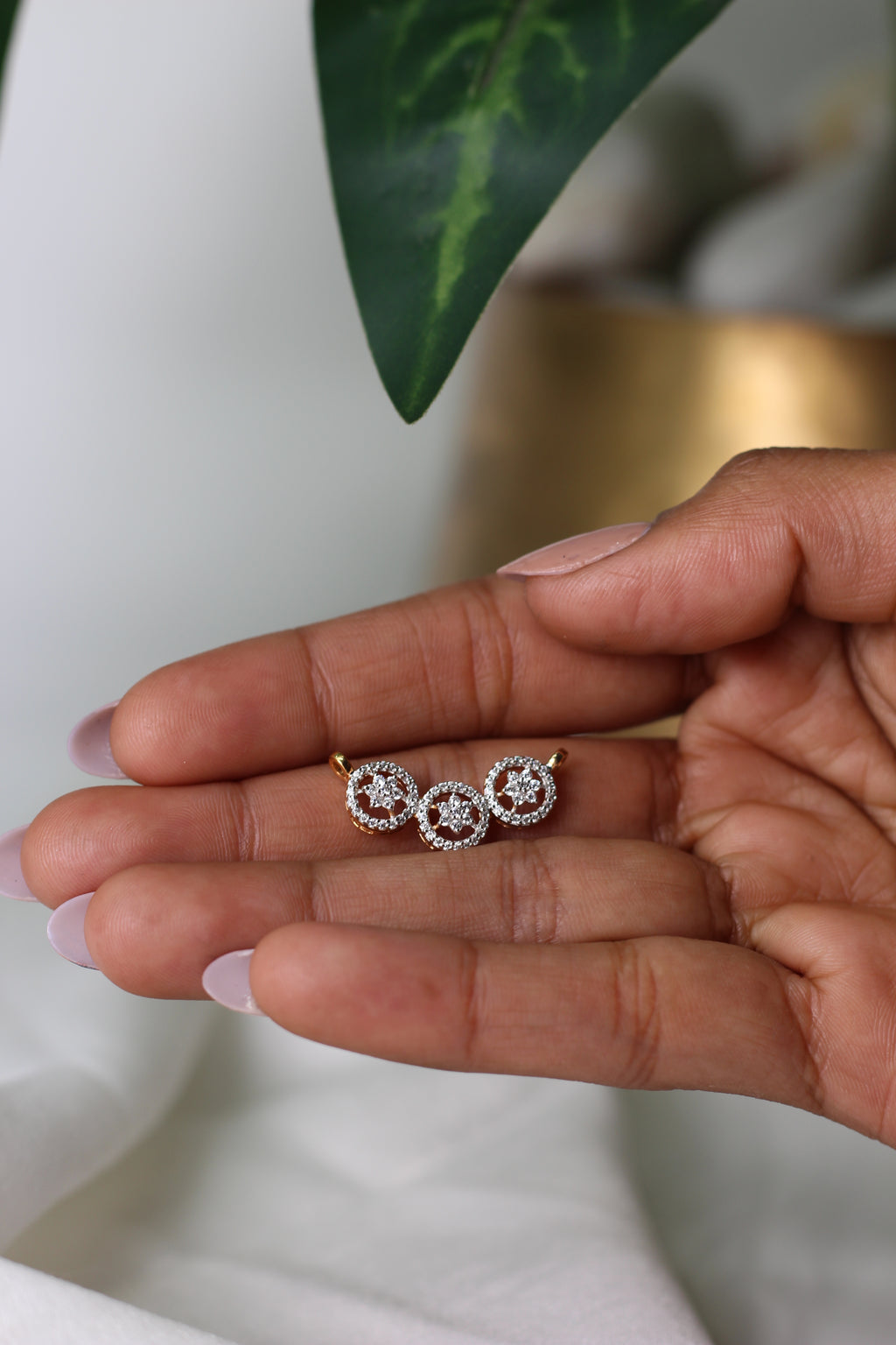 Triple Circle Gold Pendant With Flower Design And Round Diamond