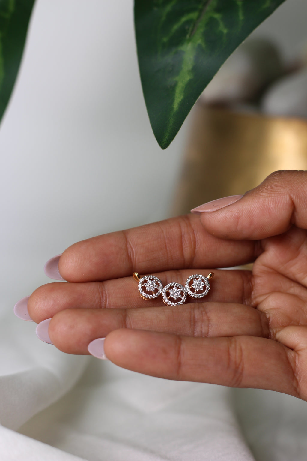 Triple Circle Gold Pendant With Flower Design And Round Diamond