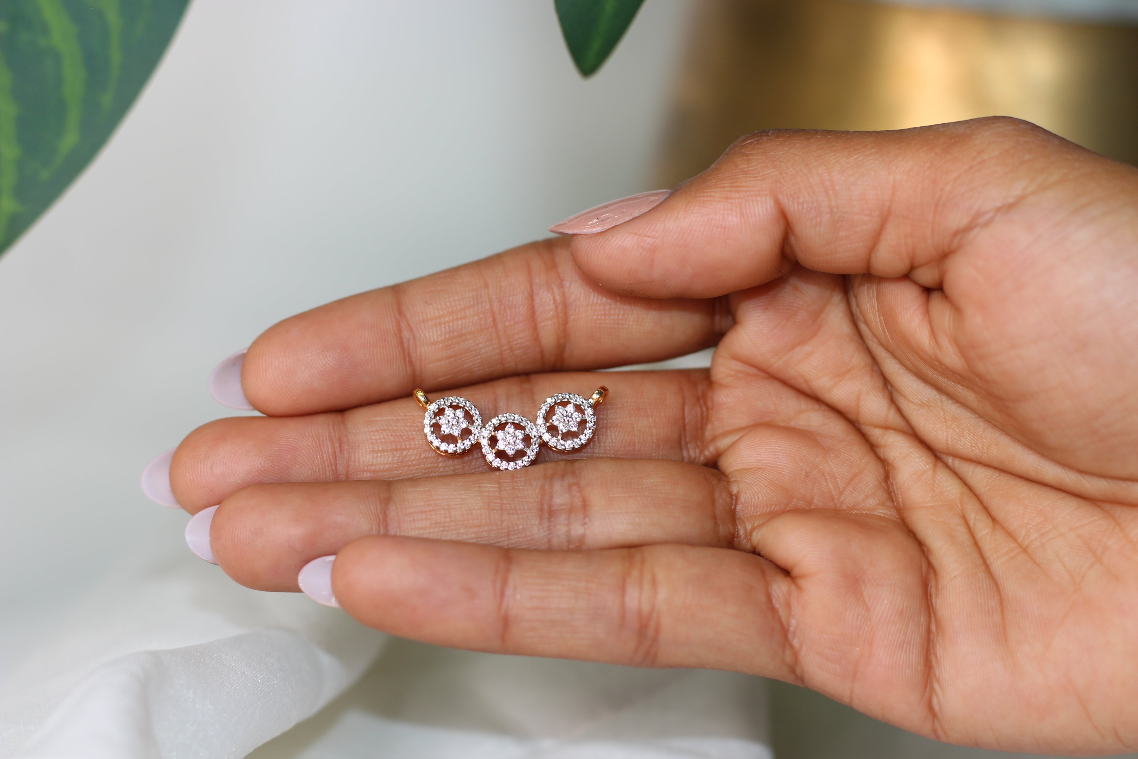 Triple Circle Gold Pendant With Flower Design And Round Diamond