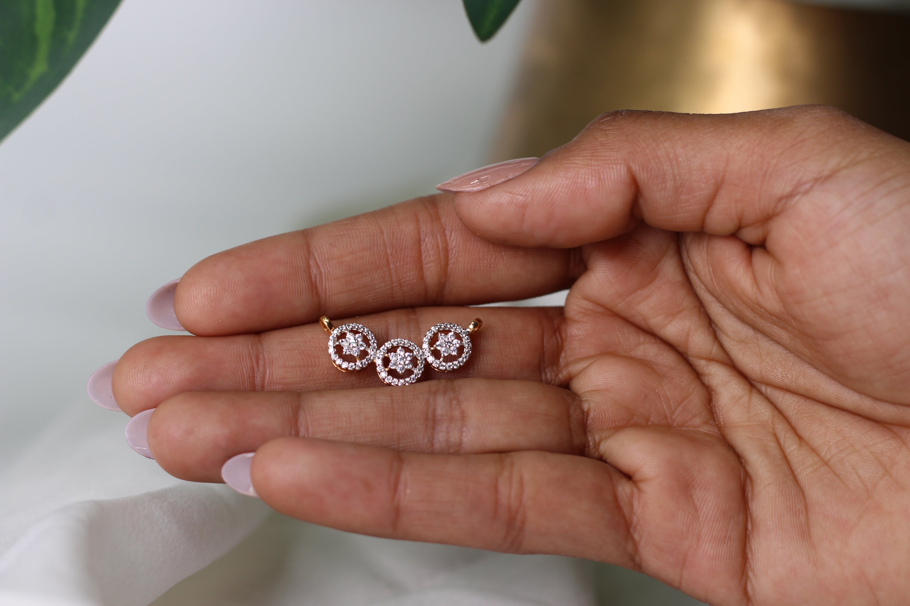 Triple Circle Gold Pendant With Flower Design And Round Diamond