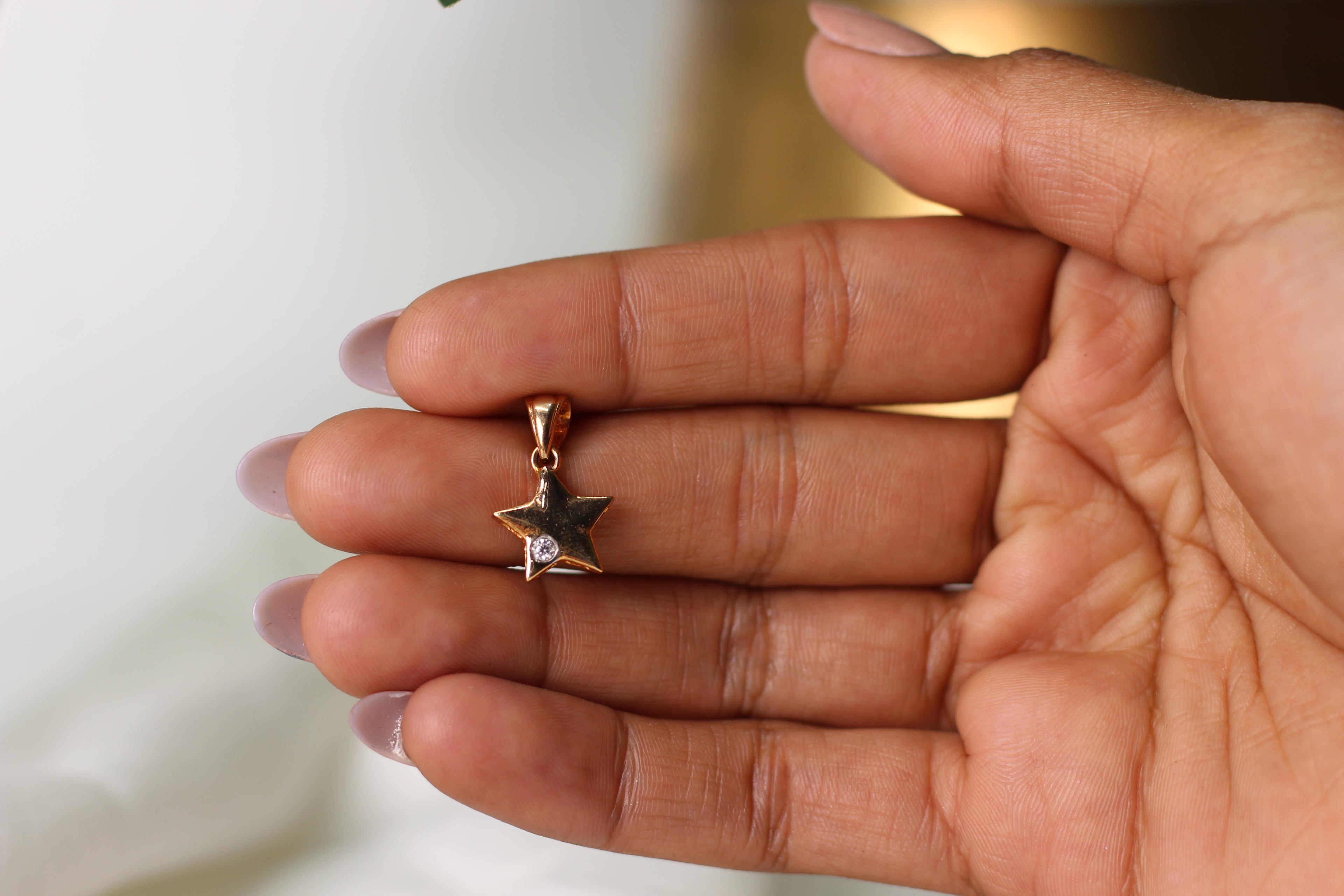 Star Shape Gold Pendant with Single Round Stone Accent