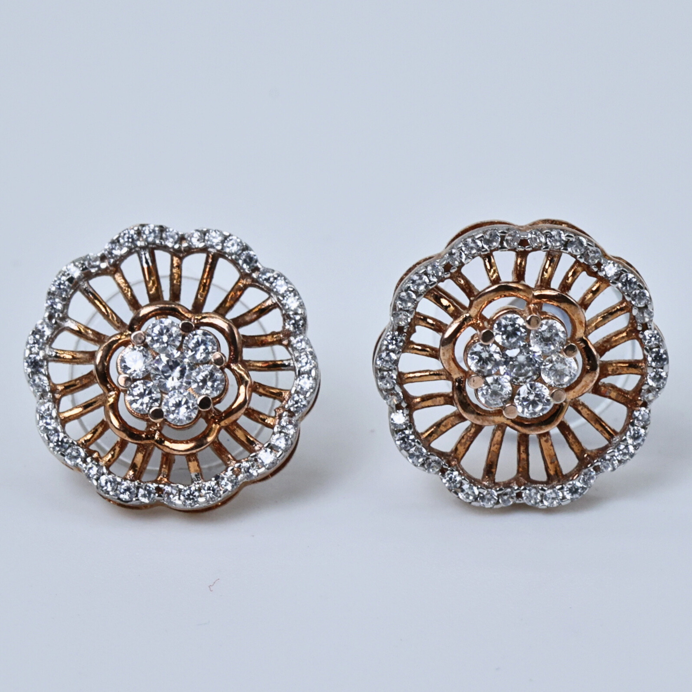 Flower shaped studs
Radiant floral studs
Simple floral studs
Floral design studs
Floral studs with radiance
Elegant floral earrings
Sculpted floral design
Flower diamond studs
Floral studs with shine
Floral design with diamonds