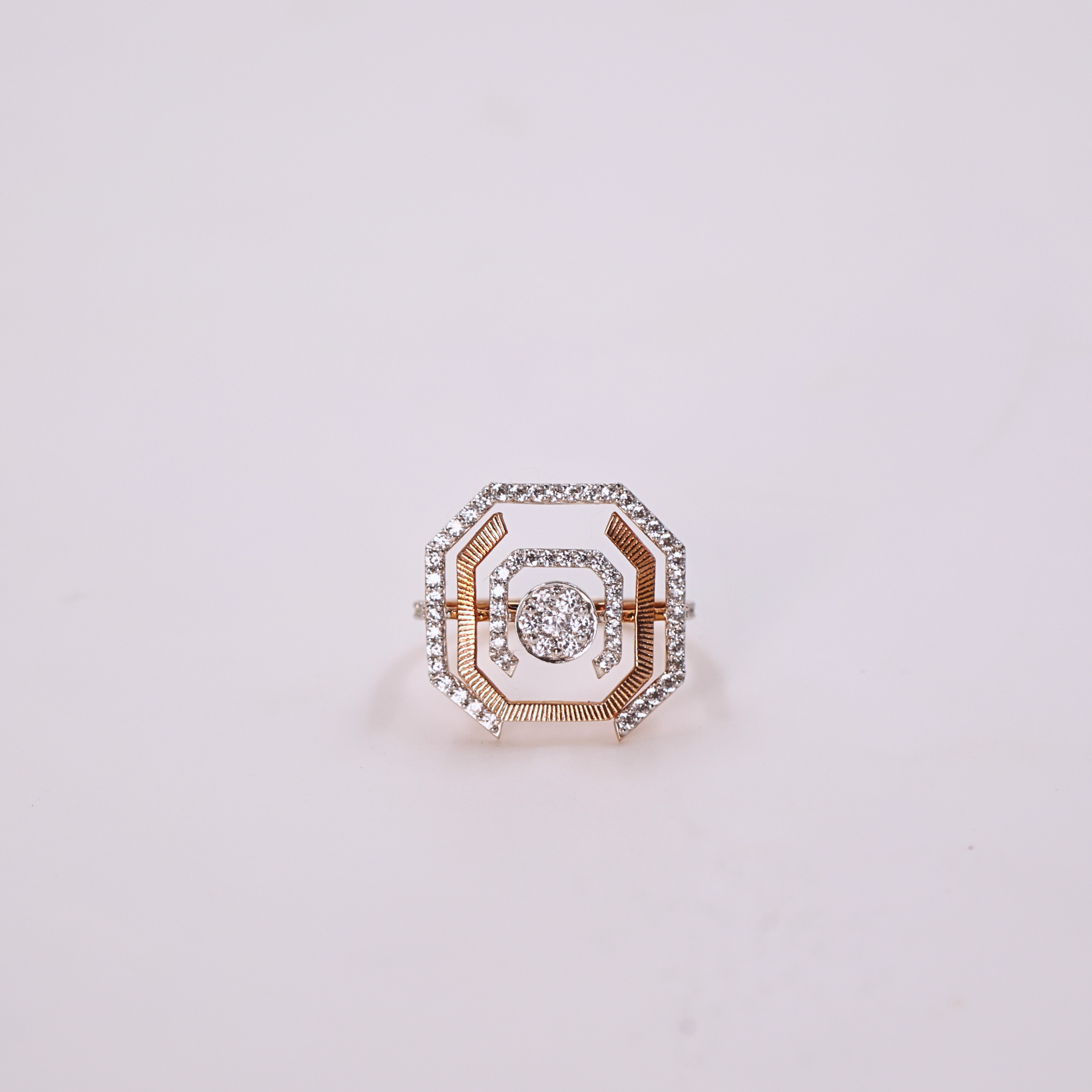 Modern halo diamond ring
Shimmering diamond ring
Radiant cut diamond centerpiece
Geometric halo diamond ring
Radiant Orbit ring close up
Square diamond with halo
Modern diamond ring design
Radiant cut center diamond
Radiant diamond halo ring
Diamond ring in natural light