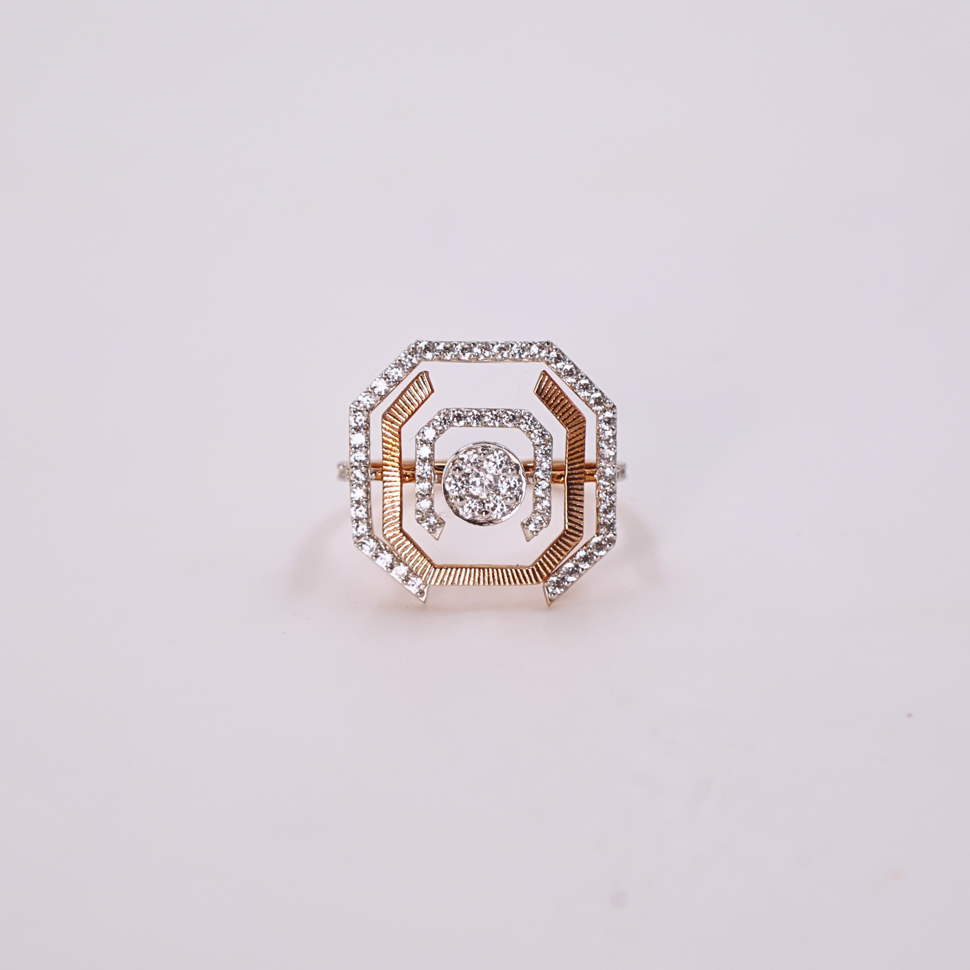 Radiant Orbit diamond ring
Square cut diamond ring
Halo diamond ring
Diamond on white gold band
Elegant engagement ring
Orbit inspired diamond band
Close up of diamond
Diamond ring top view
Side view of diamond ring
White gold diamond ring
