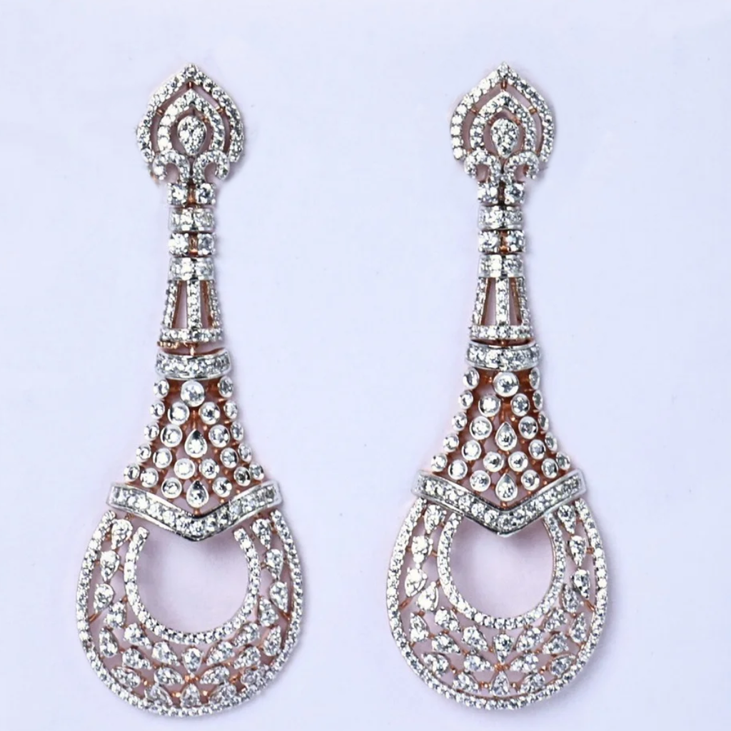 Royal Filigree diamond earrings
Teardrop diamond earrings
Elegant teardrop earrings
White gold diamond earrings
Filigree pattern earrings
Close up teardrop earrings
Delicate diamond earrings
Filigree design earrings
Front view teardrops
Shimmering diamond studs