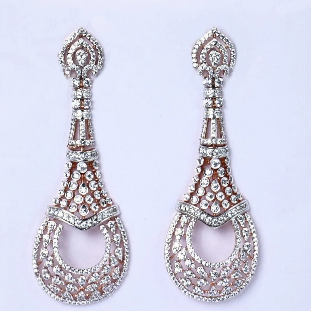 Royal Filigree diamond earrings
Teardrop diamond earrings
Elegant teardrop earrings
White gold diamond earrings
Filigree pattern earrings
Close up teardrop earrings
Delicate diamond earrings
Filigree design earrings
Front view teardrops
Shimmering diamond studs