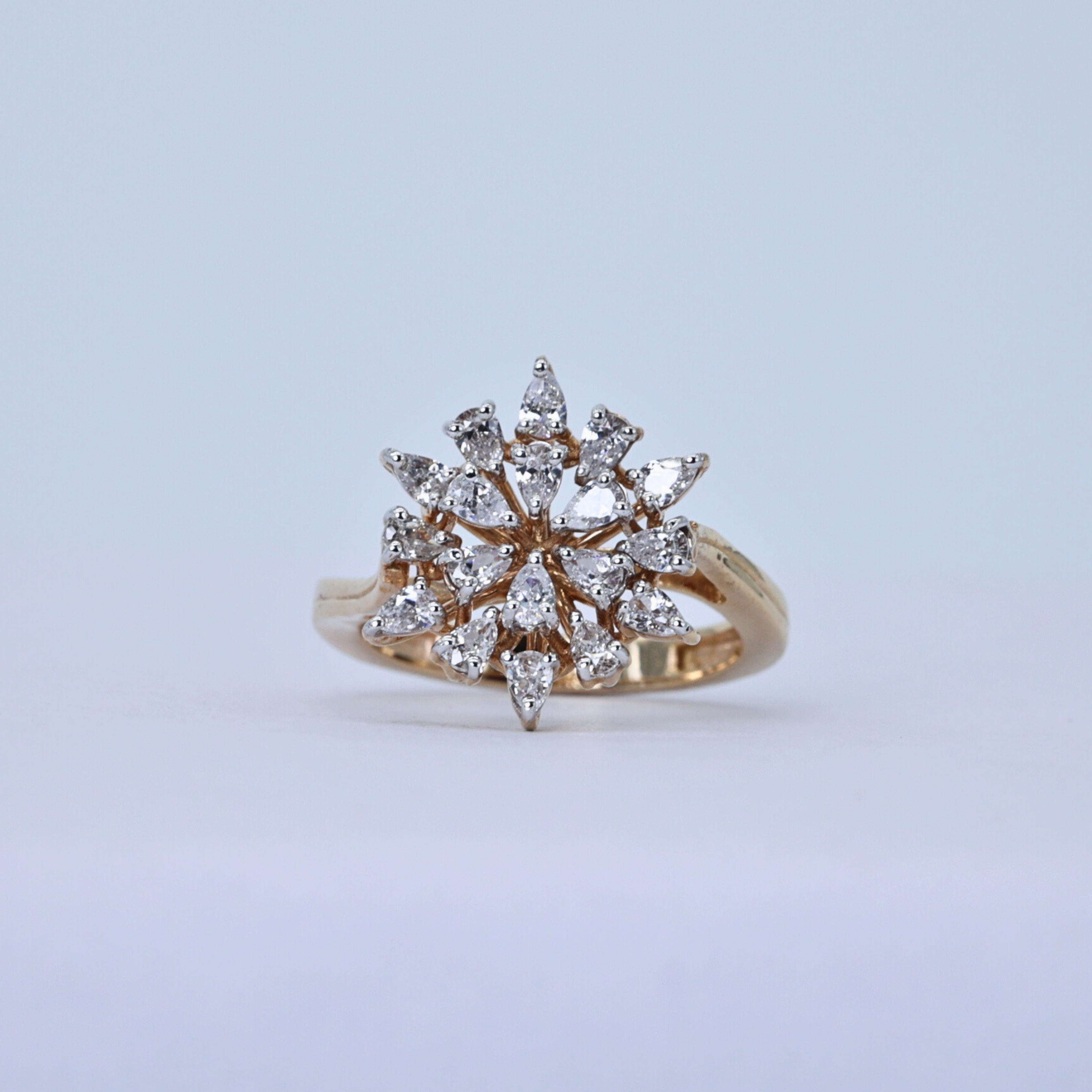 Starburst Cluster diamond ring
Diamond cluster ring
Starburst diamond ring
Diamond ring on gold band
Elegant engagement ring
Close up of diamond cluster
Starburst diamond centerpiece
Diamond ring top view
Side view of diamond ring
Gold band diamond ring